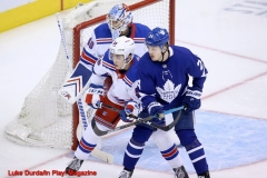 Toronto Maple Leafs Kasperi Kapanen and NY Rangers John Gilmour battle for position-  Luke Durda/In Play! Magazine